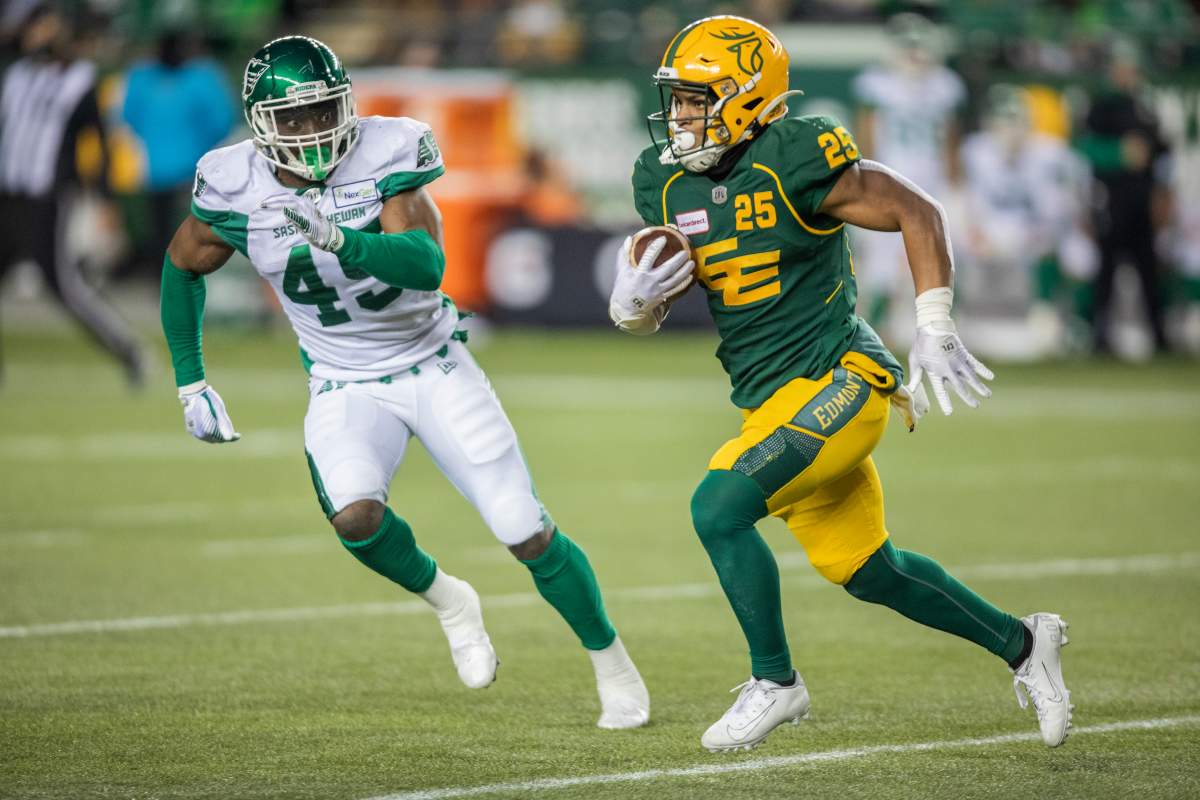 Saskatchewan Roughriders Deon Lacey (45) chases Edmonton Elks Walter Fletcher (25) during first half CFL action in Edmonton, Alta., on Friday November 5, 2021. 