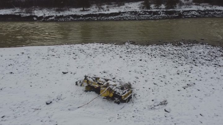 A wrecked truck carried away by the Tulameen River during last month's flooding.