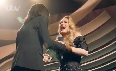 Adele and Miss McDonald share a few tears during their on-stage reunion.