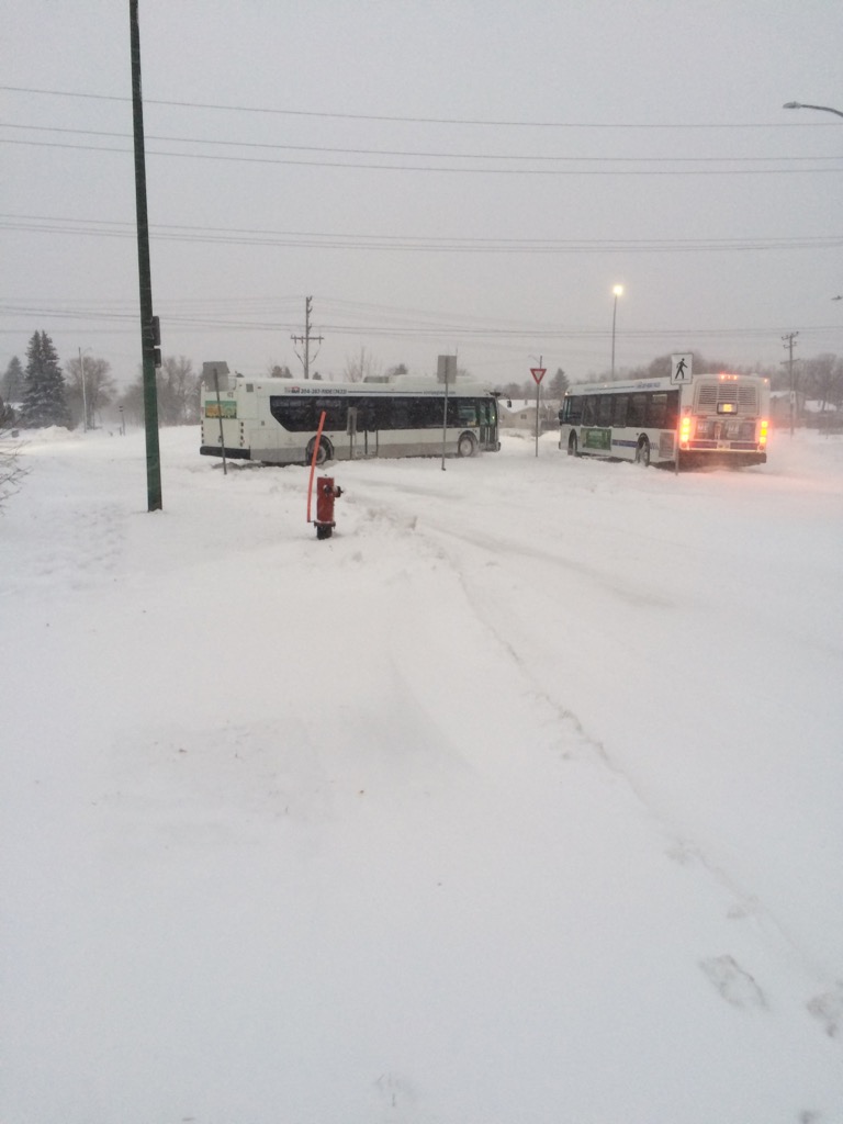 A pair of buses reportedly stuck in snow at Sun Valley Drive and Gateway Road Friday morning.