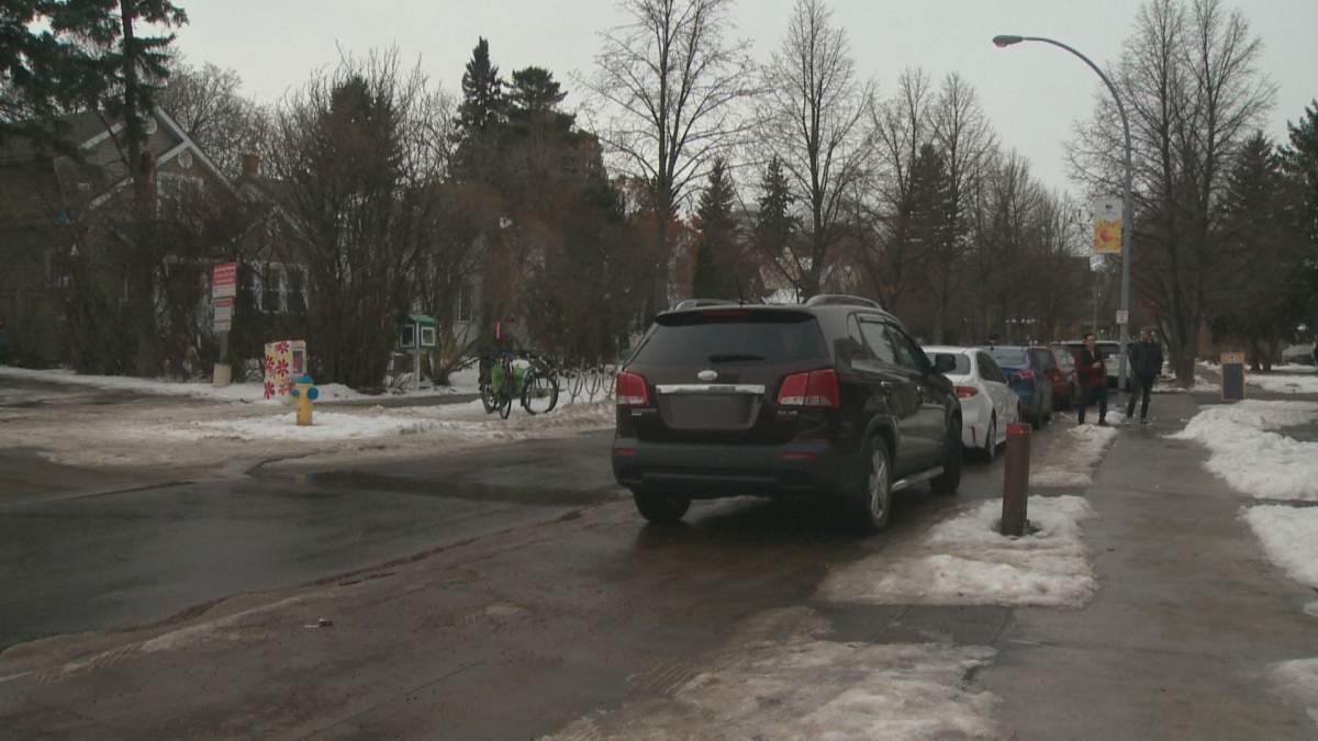Vehicles were parked on the new 88 Avenue two-way protected bike lane on Sunday.