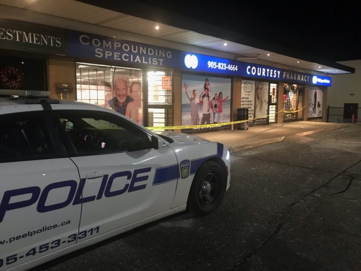 Police at the scene of an attempted pharmacy robbery in the area of Clarkson and Christopher roads in Mississauga on Monday.