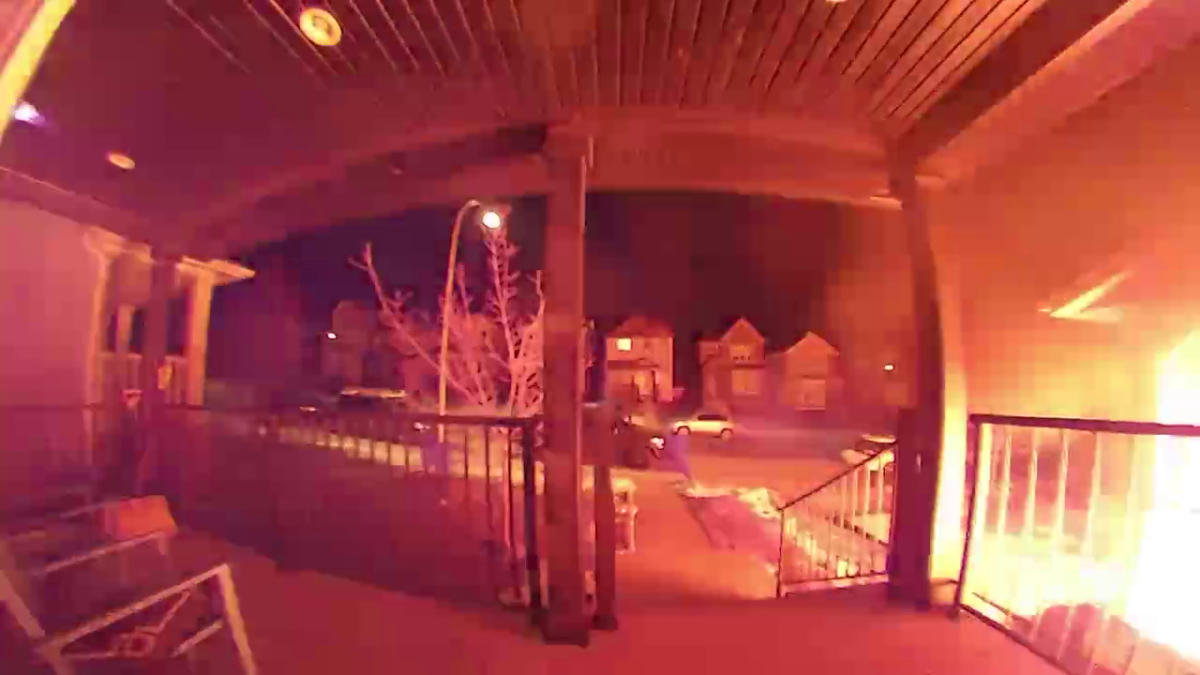 CCTV footage from a Dec. 3, 2020 multiple house fire in Calgary's Nolan Hill neighbourhood appears to show two people run away following the start of a fire.
