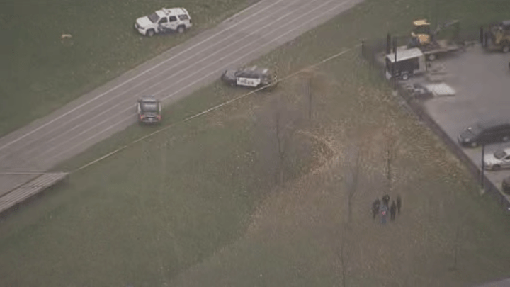 Police are seen at York Memorial Collegiate Institute after a stabbing incident Tuesday.