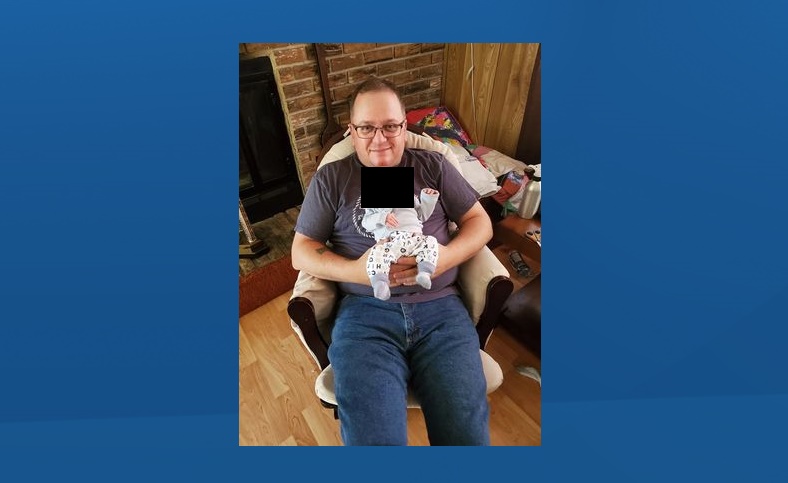 Cordell Maclellan, 44, was shot during a robbery in Edson, Alta. He was rushed to hospital where he later died of his injuries. Maclellan is pictured here with his newborn son.