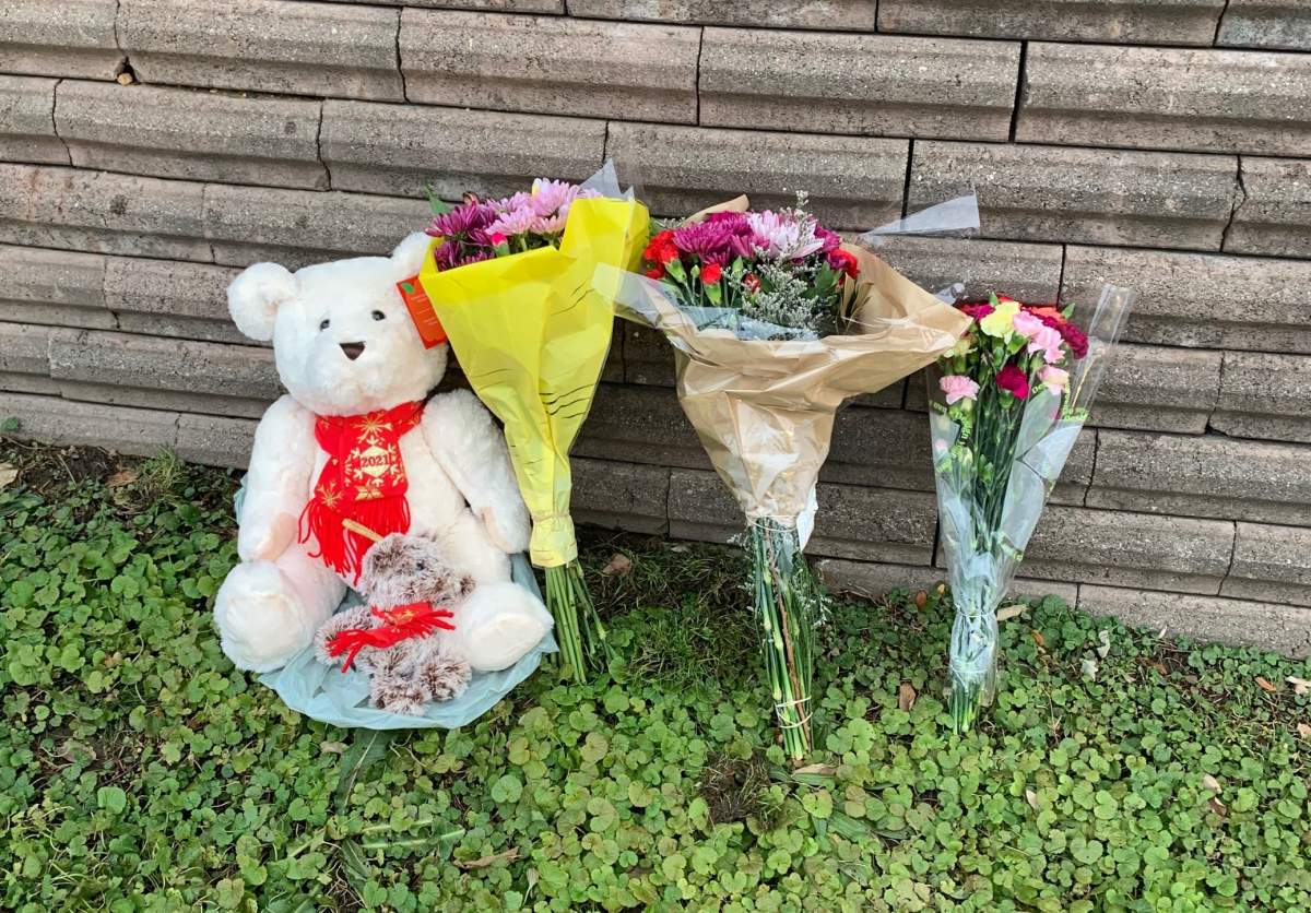 A small memorial sits along Riverside Drive near Wonderland Road on Wednesday, Dec. 1, 2021.
