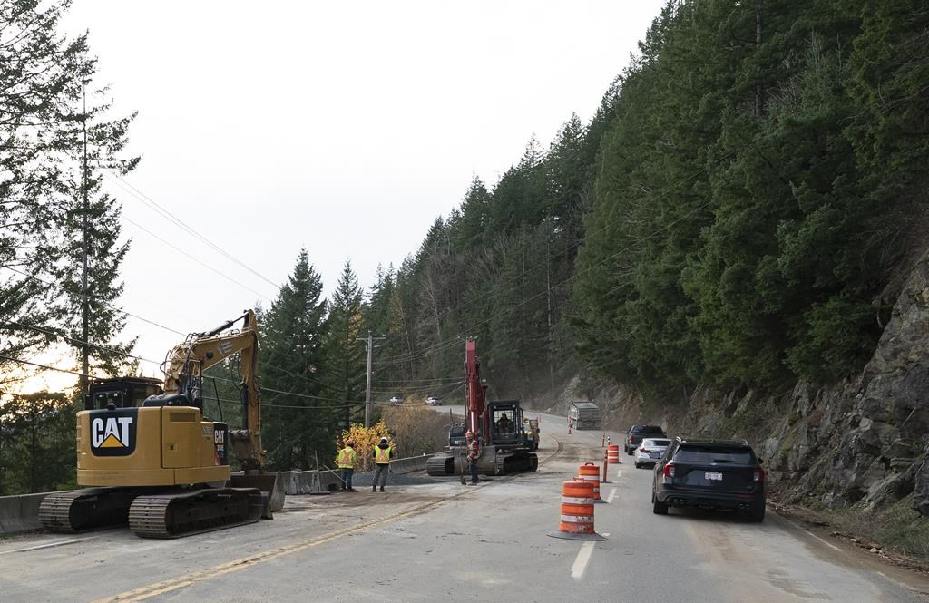 Construction crews work to reopen a lane on Highway 7 west of Agassiz, B.C., Wednesday, Nov. 17, 2021.&nbsp;B.C. organizations are rallying together to deliver food to remote Indigenous nations after devastating floods cut off access to communities last month. THE CANADIAN PRESS/Jonathan Hayward.