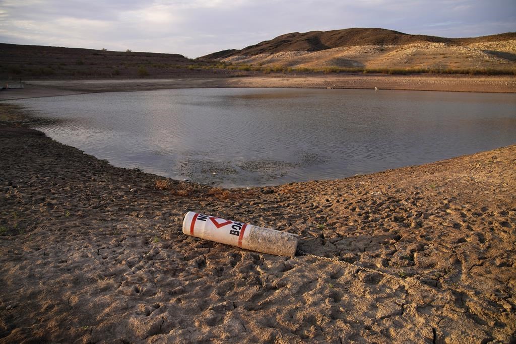 A buoy rests on the ground at a closed boat ramp on Lake Mead at the Lake Mead National Recreation Area near Boulder City, Nev., on Aug. 13, 2021