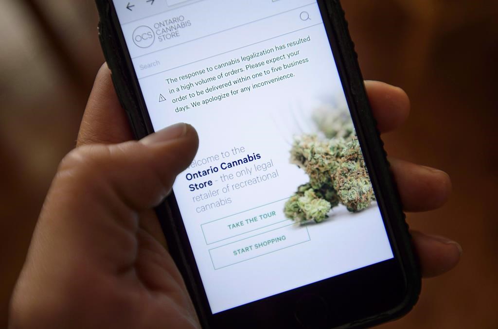 A Ontario Cannabis Store website pictured on a mobile phone, in Ottawa, Thursday, Oct. 18, 2018. Ontario’s cannabis regulator is taking aim at licensed pot shops it's found selling unregulated products. THE CANADIAN PRESS/Sean Kilpatrick.