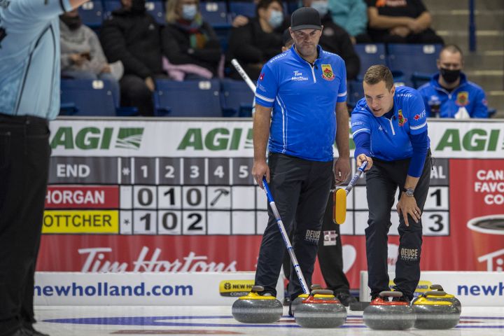 Team Bottcher skip Brendan Bottcher, right, instructs third Darren Moulding as they take on team Horgan during Draw 4 of the 2021 Canadian Olympic curling trials in Saskatoon, Sask., Sunday, Nov. 21, 2021. 