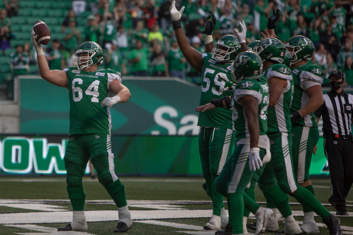 Offensive lineman Evan Johnson (64) celebrates after the Roughriders scored a touchdown during CFL football action against the Ottawa Redblacks in Regina on Aug. 21, 2021.