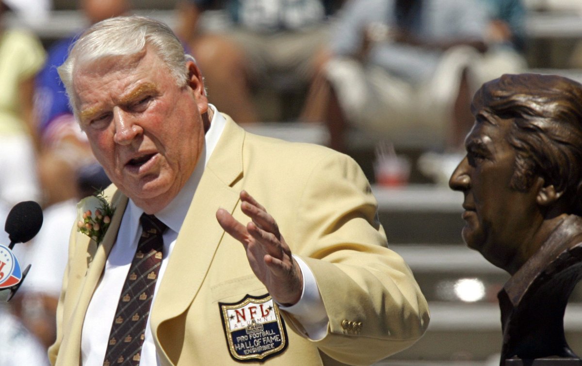 FILE - In this Aug. 5, 2006, file photo, former Oakland Raiders coach John Madden gestures toward a bust of himself during his enshrinement into the Pro Football Hall of Fame in Canton, Ohio. After a decade run as a successful coach of the Raiders, Madden made his biggest impact on the game after moving to the broadcast booth at CBS in 1979. He became the network's lead analyst two years later and provided the sound track for NFL games for most of the next three decades, entertaining millions with his interjections of "Boom!" and "Doink!" throughout games, while educating them with his use of the telestrator and ability to describe what was happening in the trenches. (AP Photo/Mark Duncan, File).