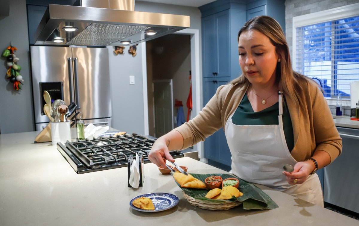 Ana Maria Moreno, who runs Valluno's Colombian Street Food and More from her home, makes empanadas in Calgary, Alta., Wednesday, Dec. 1, 2021.