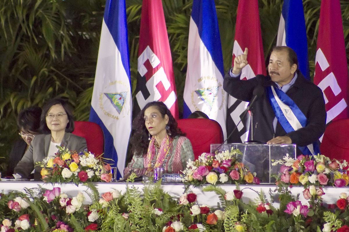 FILE - Nicaragua's President Daniel Ortega speaks during his inauguration ceremony, next to his wife Vice President Rosario Murillo, center, and Taiwan's President Tsai Ing-wen in Managua, Nicaragua, Tuesday, Jan. 10, 2017. Taiwan lost Nicaragua as a diplomatic ally, Thursday, Dec. 9, 2021, after the Central American country said it would officially recognize only China, which claims self-ruled Taiwan as part of its territory. (AP Photo/Miguel Alvarez, File).