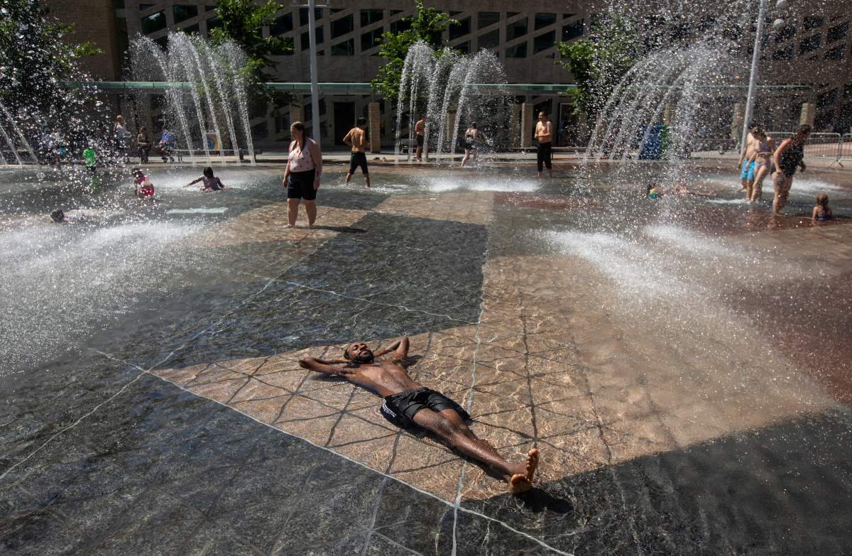 Kais Bothe relaxes in the cool in the city hall pool, as temperatures hit 37 degrees Celsius in Edmonton, Alta., on Wednesday, June 30, 2021.