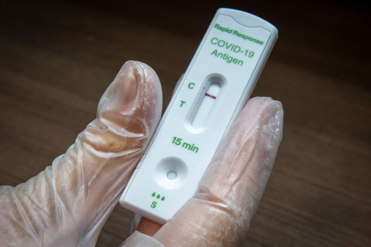 A negative rapid response COVID-19 antigen test result.