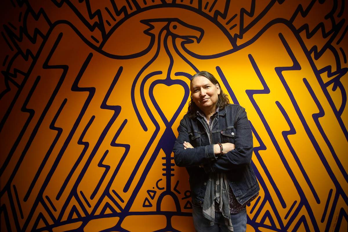 David Mcleod, CEO of NCI FM, is photographed with a new mural by Jordan Stranger commemorating the 50th anniversary of NCI in Winnipeg, Thursday, Dec. 9, 2021. THE CANADIAN PRESS/John Woods