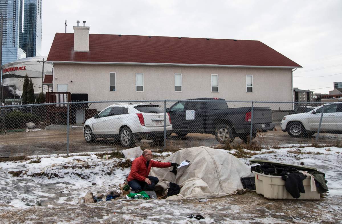 A file photo where Manager of H.E.L.P. Team Boyle Street Community Services Doug Cooke and Outreach and Support Services Senior Manager Jared Tkachuk check on homeless people in Edmonton, Thursday, Dec. 9, 2021.