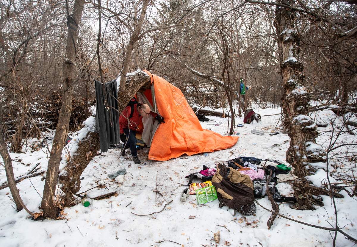 Manager of H.E.L.P. Team Boyle Street Community Services Doug Cooke checks on homeless people and hands out supplies in Edmonton, Thursday, Dec. 9, 2021.