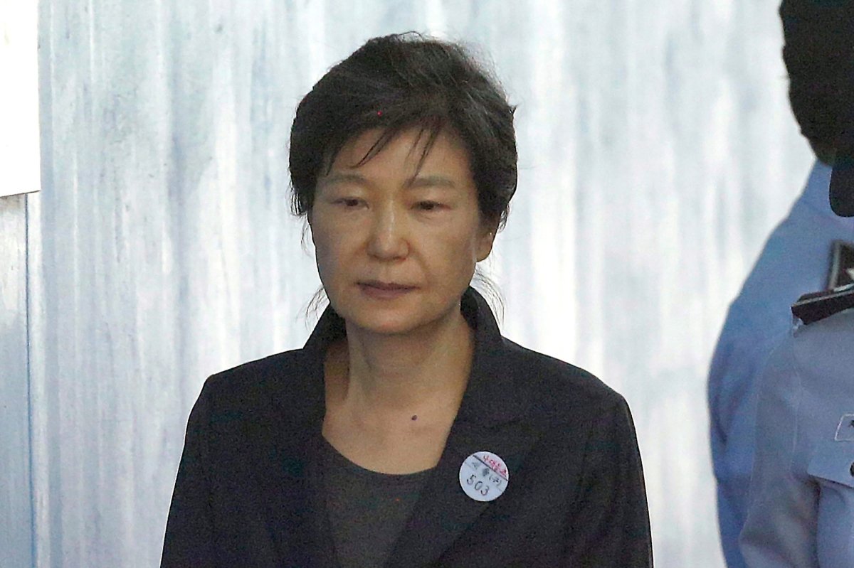 FILE - Former South Korean President Park Geun-hye arrives to attend a hearing on the extension of her detention at the Seoul Central District Court in Seoul, South Korea on Oct. 10, 2017. South Korea said Friday, Dec. 24, 2021 it will grant a special pardon to Park who is serving a lengthy prison term for a series of corruption charges. (AP Photo/Ahn Young-joon, File).