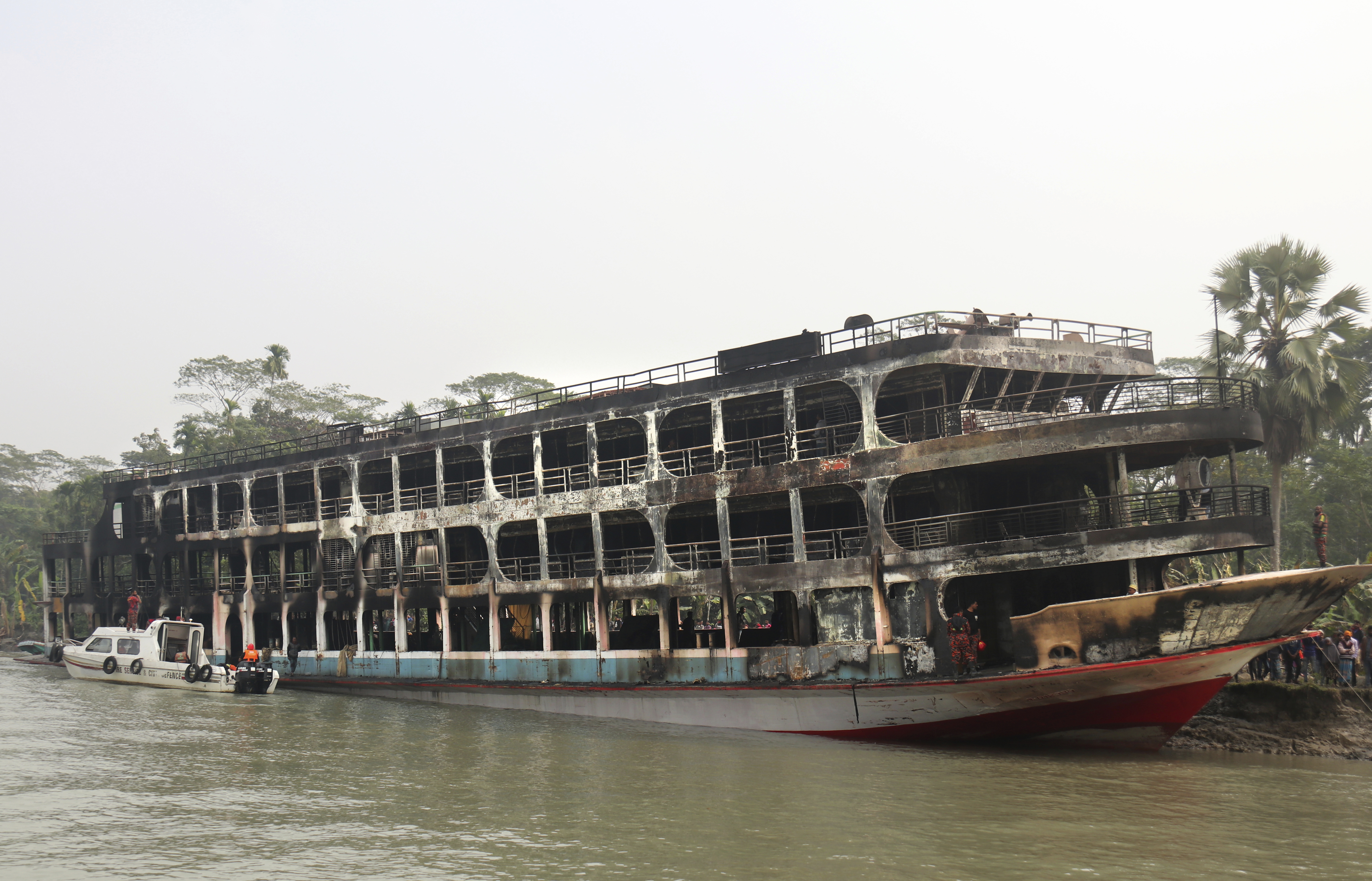 At least 39 dead after ferry fire forces escape to frigid Bangladesh
river