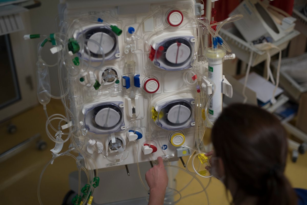 A healthcare worker prepares a dialysis machine to be used for COVID-19 patients in the intensive care unit at the Joseph Imbert Hospital Center in Arles, southern France, W.