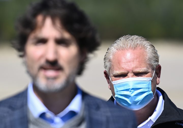 Canadian Prime Minister Justin Trudeau, front, speaks as Ontario Premier Doug Ford listens after taking part in an event in Gogama, Ont., on Friday, September 11, 2020.