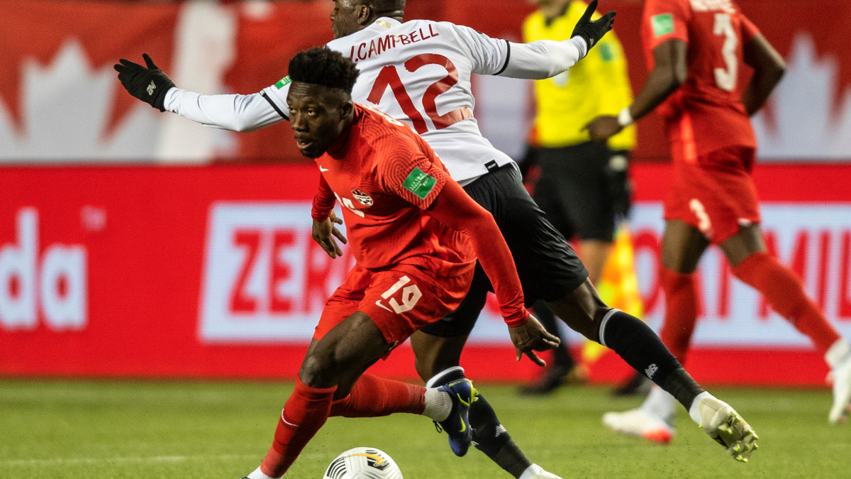 Team Canada's Alphonso Davies (19) makes a move on Costa Rica's Joel Nathaniel Campbell Samuels (12) during first half World Cup qualifier soccer action in Edmonton on Friday, November 12, 2021.