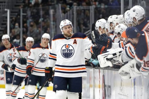 Edmonton Oilers center Leon Draisaitl (29) is congratulated by teammates after scoring against the Seattle Kraken during the first period of an NHL hockey game Friday, Dec. 3, 2021, in Seattle.