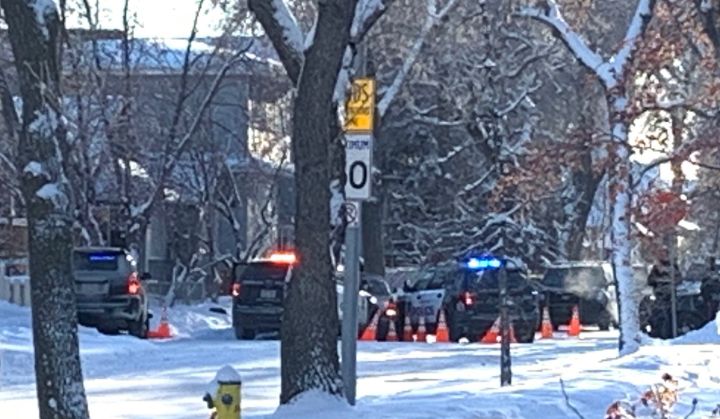 Edmonton police cars are seen in the area of 116 Avenue and 92 Street where officers fatally shot a suspect on Dec. 31, 2021.