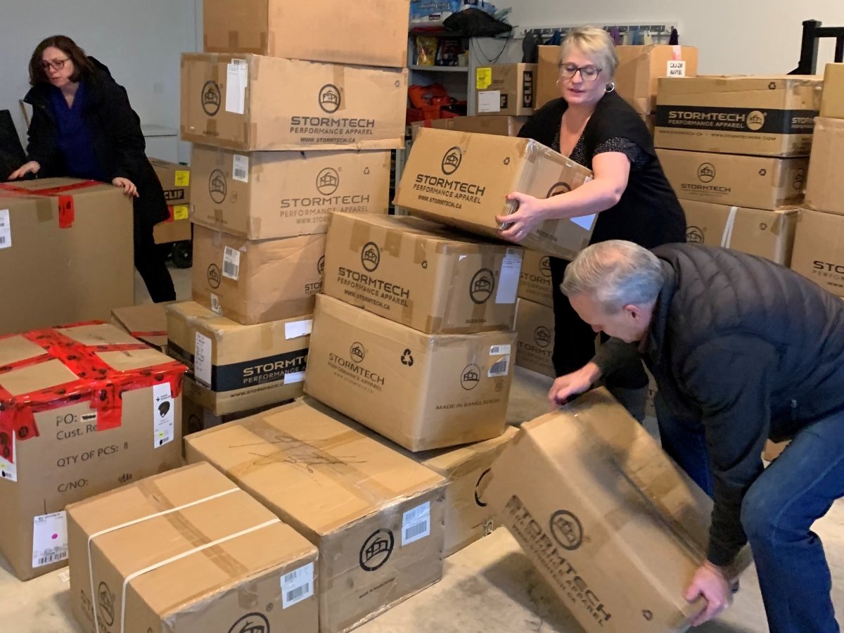 Boxes of new clothes were bound for flood-ravaged Princeton, B.C., on Thursday. Here, members of the Rotary Club of Golden Ears Sunrise in Maple Ridge are seen loading them for transport.