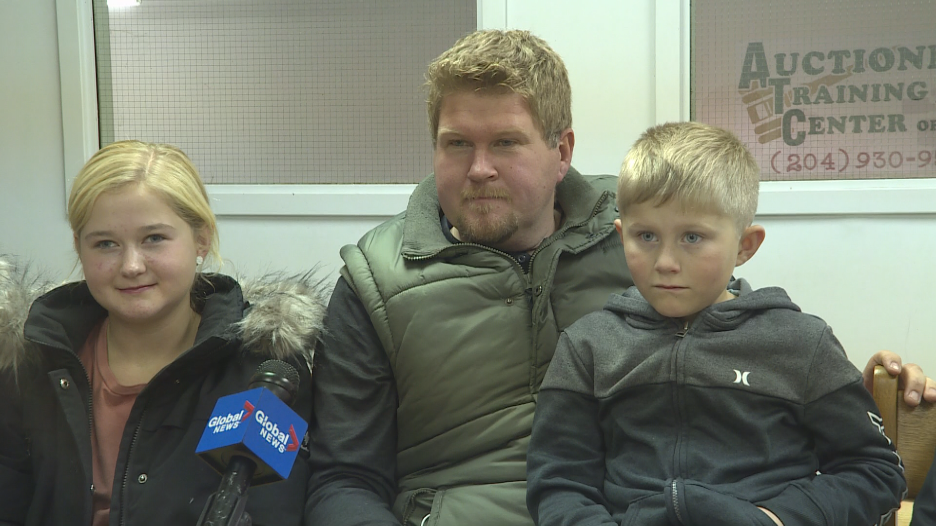 Heidi Braun, 13, (left), sits next to her dad, Mark.