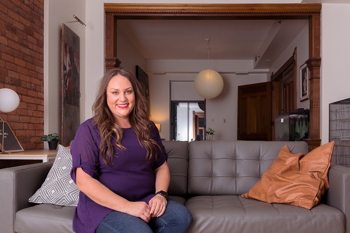 Jolene Donatelli sits in the newly redesigned living room at Maison d'Hérelle.