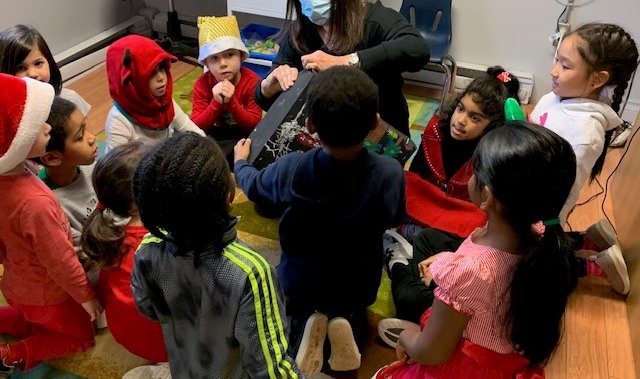 Pre-kindergarten students at Sunshine Academy receive special package from North Pole