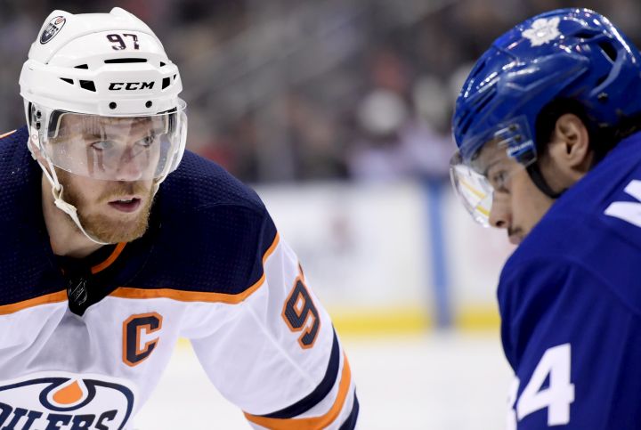 Edmonton Oilers centre Connor McDavid (97) takes a faceoff against Toronto Maple Leafs centre Auston Matthews (34) during first period NHL action in Toronto, Wednesday, Feb. 27, 2019.