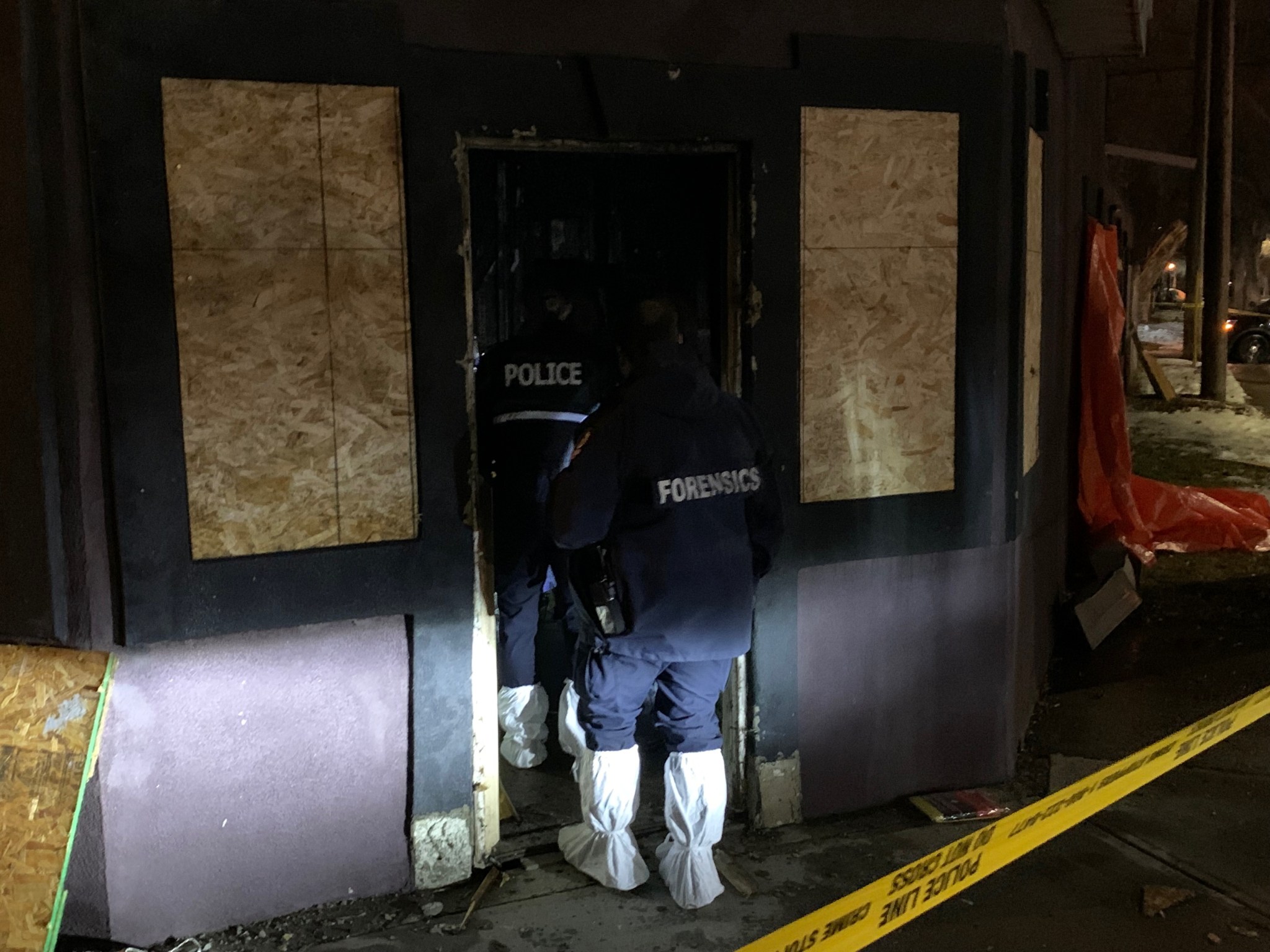 Edmonton Police Service investigators on scene after a man’s body was found in an burnt building at the corner of 95 Street and 106 Avenue in the central Edmonton McCauley neighbourhood on Wednesday, December 1, 2021.