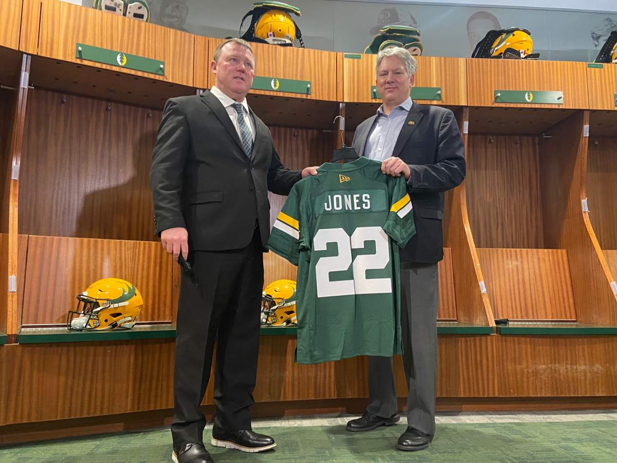 Chris Jones poses with a 2022 Edmonton Elks jersey