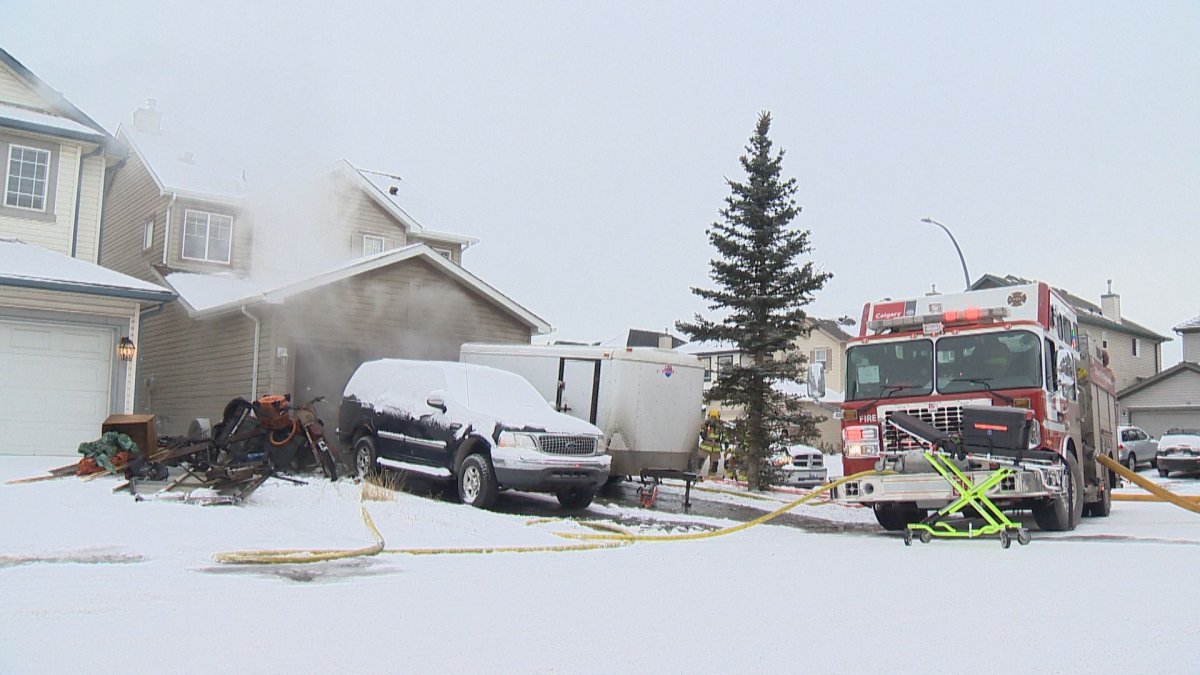 Calgary fire crews attend a garage fire on Martha's Meadow Close N.E., pictured on Dec. 14, 2021.