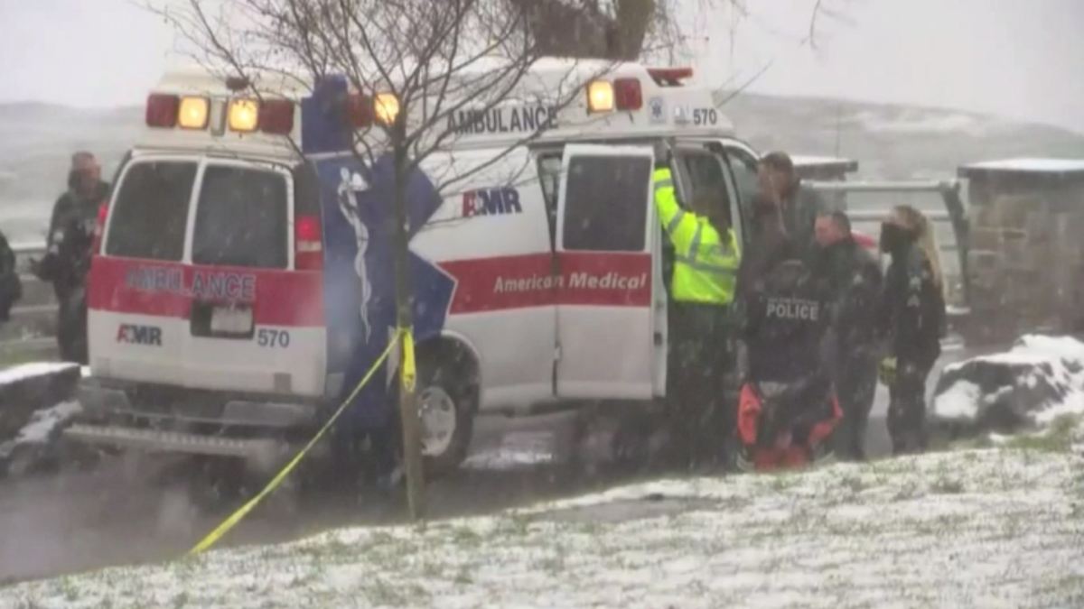Ambulance and rescue teams on scene at the Niagara River Dec. 8, 2021 following the discovery of a sedan floating on the waterway.