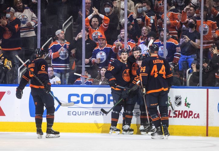 Edmonton Oilers’ Kris Russell (6), Zach Hyman (18), Connor McDavid (97) and Zack Kassian (44) celebrate a goal against the Pittsburgh Penguins during first period NHL action in Edmonton on Wednesday, December 1, 2021.