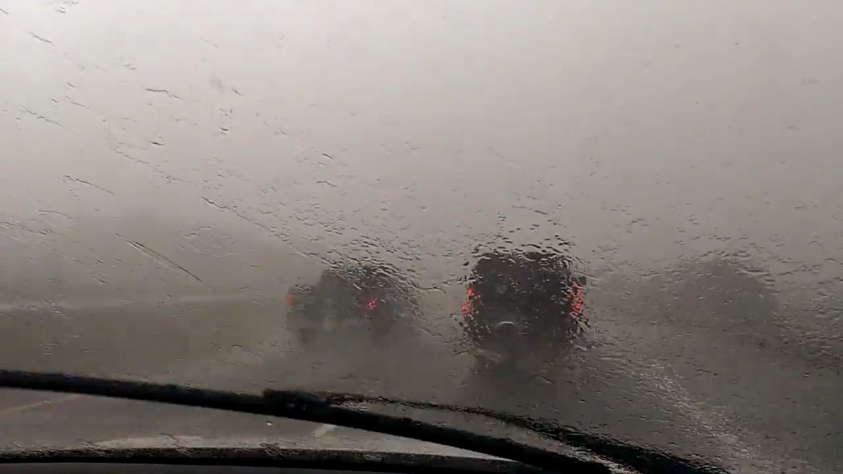 Passenger in SUV takes picture of heavy rain while on Highway 403 in Hamilton.