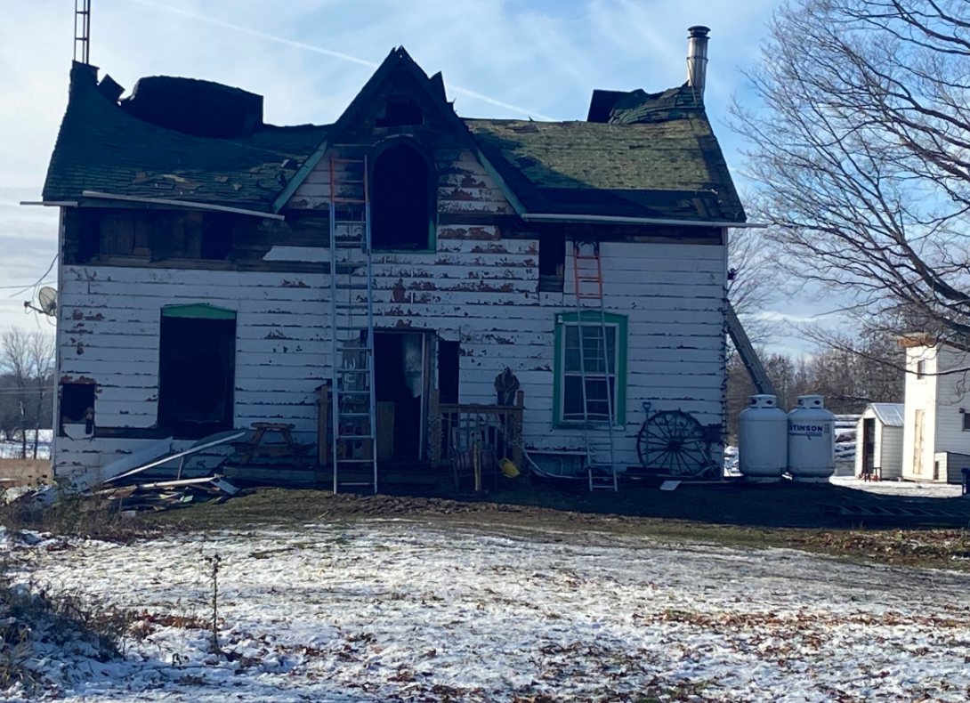 A fire at a home in Westport, Ont. has claimed the life of one person and sent two firefighters to hospital.