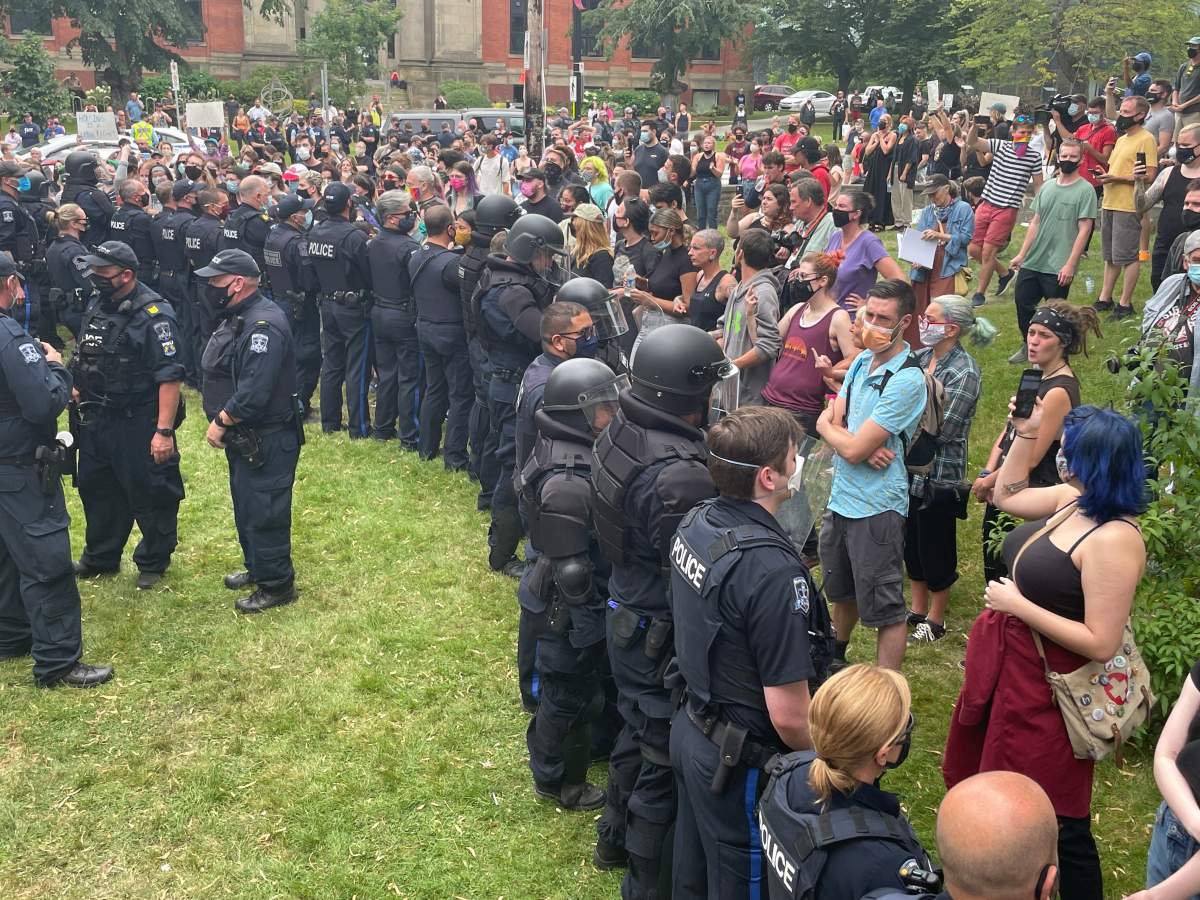 Dozens of Halifax Regional Police officers showed up in riot gear to tear down shelters on Aug. 18, 2021.
