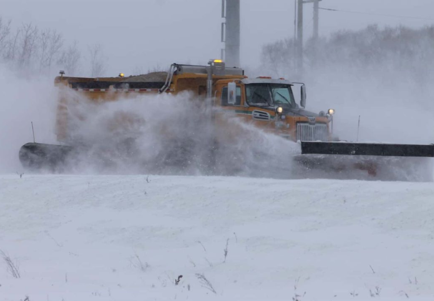 A snow plow is seen on a Manitoba road in this file photo.