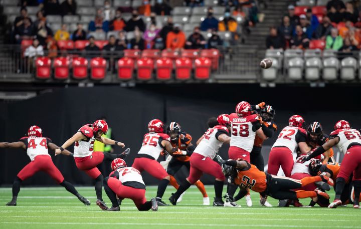 Calgary Stampeders' Rene Paredes, second left, kicks a field goal against the B.C. Lions during the second half of a CFL football game in Vancouver, on Saturday, October 16, 2021. 