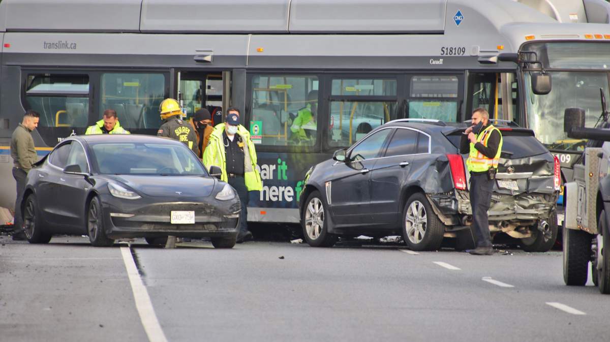 Police, firefighters and paramedics respond to a multi-vehicle collision on King George Boulevard in Surrey, B.C. on Dec. 5, 2021.