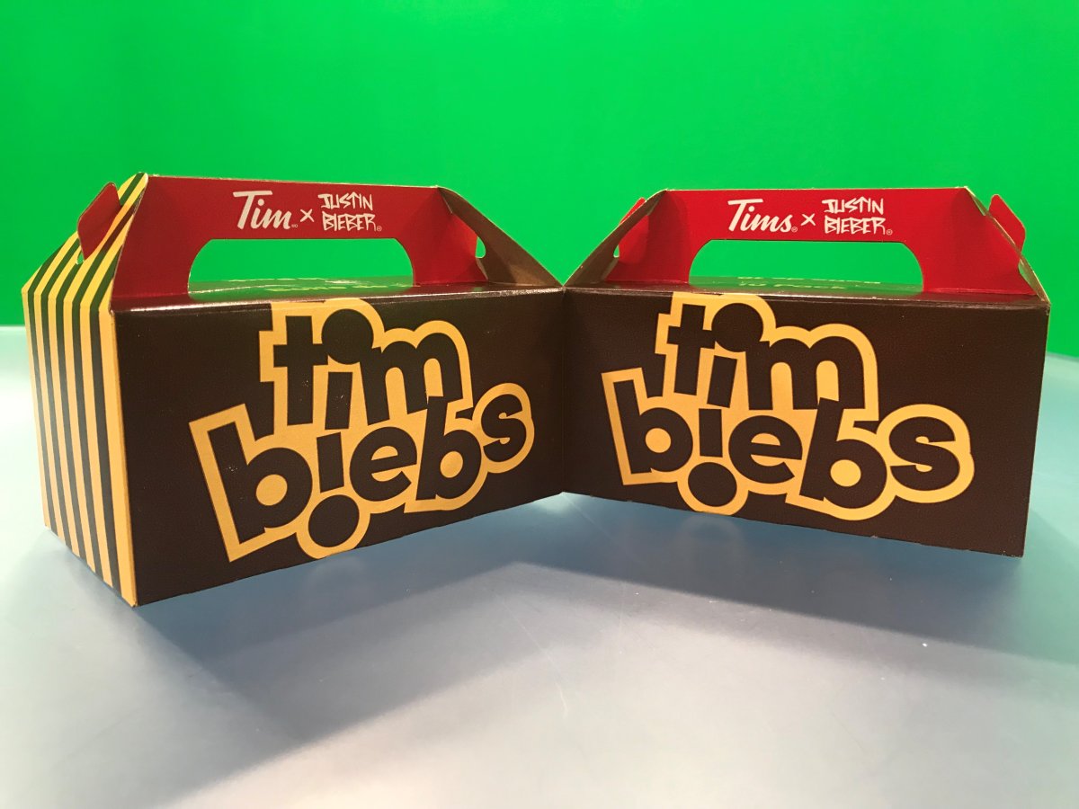 A photo of two Timbiebs boxes, minus the doughnut holes. 