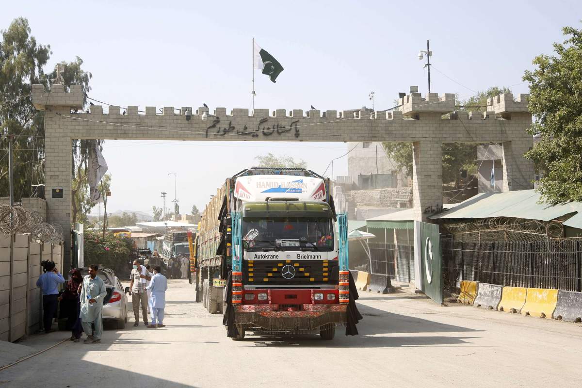 Trucks entering Pakistan at the border crossing point of Torkham between Pakistan and Afghanistan in northwest Pakistan’s Torkham on Sept. 3, 2021.