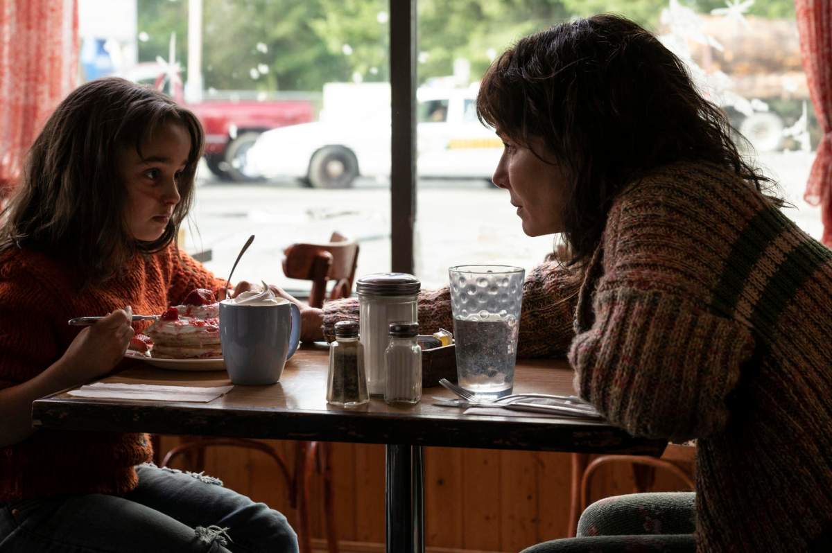 Edmonton actress Neli Kastrinos, 8, alongside actress Sandra Bullock in a still from The Unforgiveable.