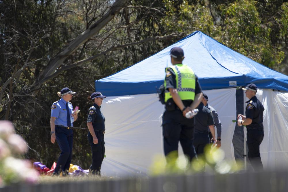 Emergency services personnel work the scene of a deadly incident involved with a jumping castle at the Hillcrest Primary School in Devonport, Tasmania, Thursday, Dec. 16, 2021. Multiple children have died and others are in critical condition after falling from a bouncy castle that was lifted 10 meters (33 feet) into the air by a gust of wind at a junior school on the island state of Tasmania.